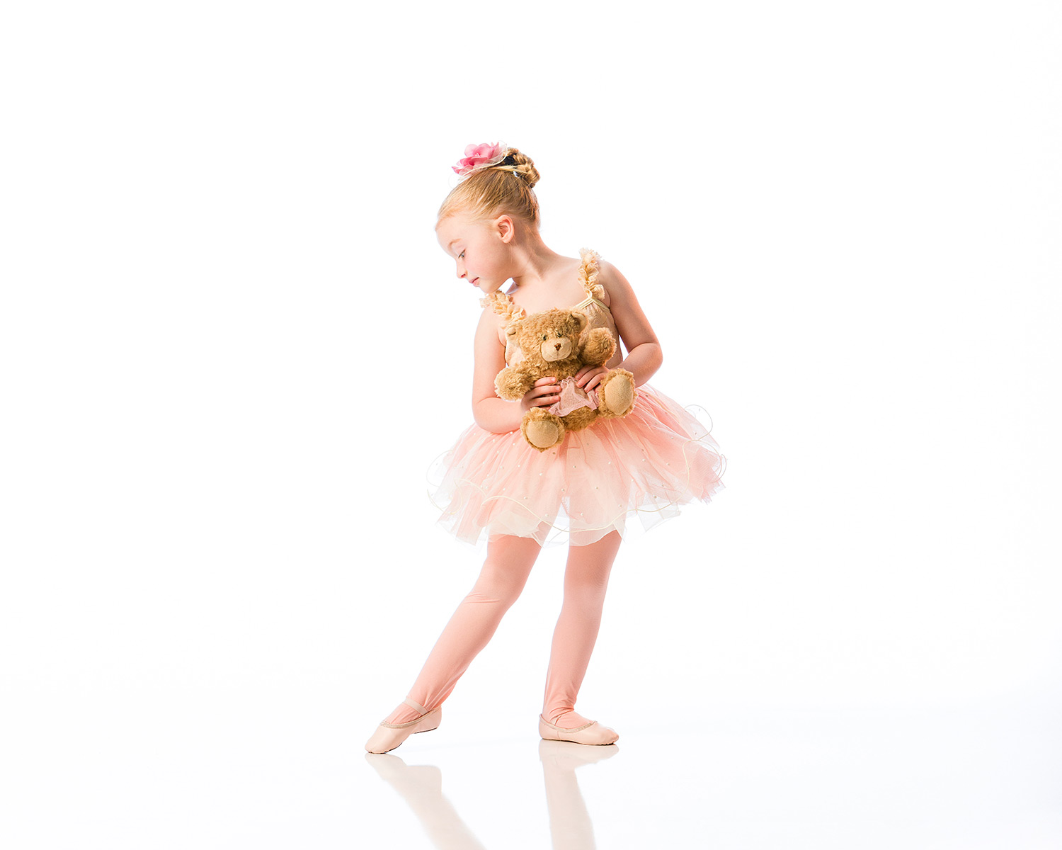 A young ballerina in a tutu points her toe. Sharon Davis School of Dance is now offering online/virtual dance classes.